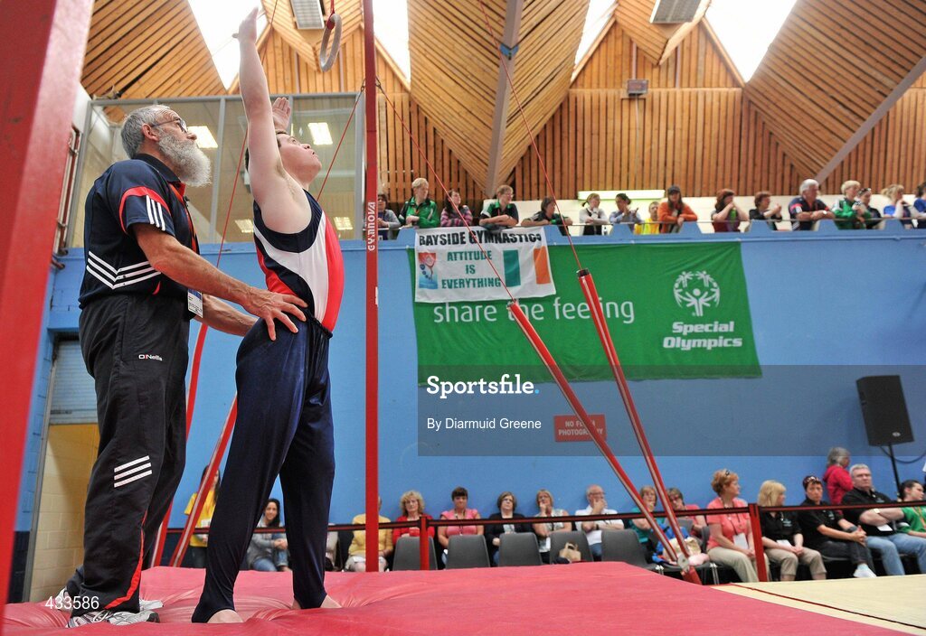 10 June 2010; Conrad McCullough, from Ennis, Co. Clare, is assisted by his father and Munster coach Brendan McCullough, as he competes on the rings during the 2010 Special Olympics Ireland Games. University of Limerick, Limerick. Picture credit: Diarmuid Greene / SPORTSFILE