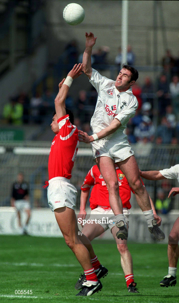 20 April 1997.Brian Fahy, Kildare, in action against Cork's Sean Og O hAilpin. Church & General   National League semi final, Croke Park.  Picture Credit: David Maher/SPORTSFILE.