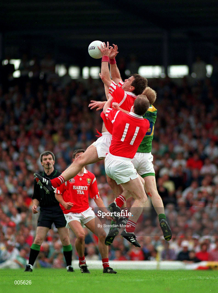 23 July 1995. Cork's Stephen O'Brien goes up for the ball with team-mate Larry Tompkins (11) and Kerry's Liam Flaherty. Munster Football Final, Kerry v Cork, Fitzgerald Stadium, Killarney, Co. Kerry. Picture Credit: Brendan Moran/SPORTSFILE.