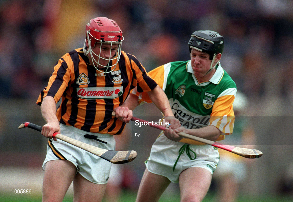 13 July 1997. Kilkenny's John Barron gets away from Offaly's Shane Horan. Leinster Minor Hurling Final, Kilkenny v Offaly, Croke Park. Picture Credit: Ray McManus/SPORTSFILE.