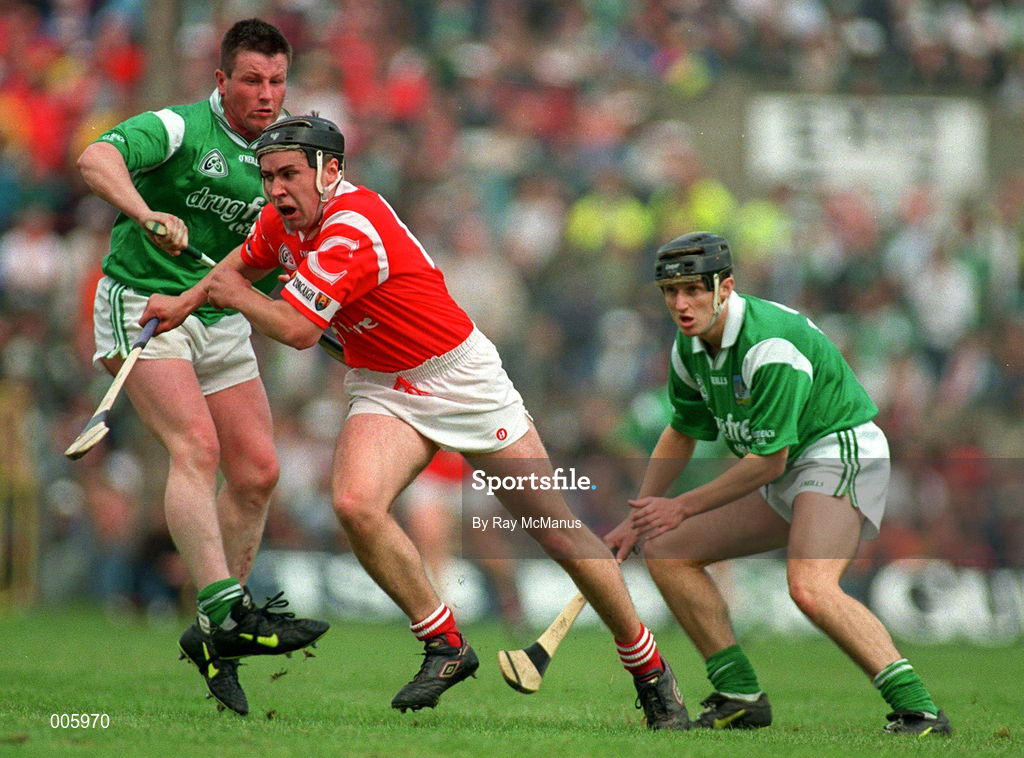 31 May 1998; Kieran Morrisson of Cork is tackled by Mike Houlihan and John Foley of Limerick during the Munster Senior Hurling Championship Quarter-Final match between Limerick and Cork at the Gaelic Grounds in Limerick. Photo by Ray McManus/Sportsfile