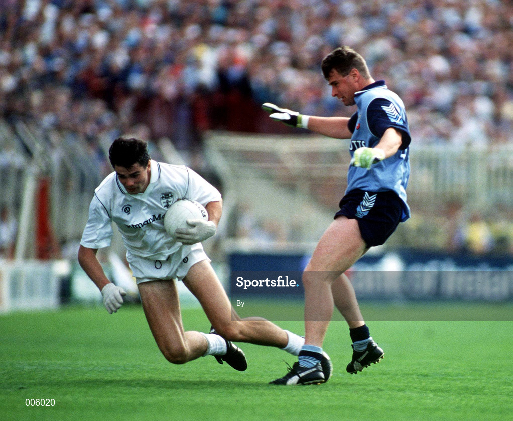 26 July 1992. Kildare's Martin Lynch holds possession despite the attention of Dublin's Charlie Redmond. Dublin v Kildare, Leinster Football Final, Croke Park. Picture Credit: Ray McManus/SPORTSFILE.