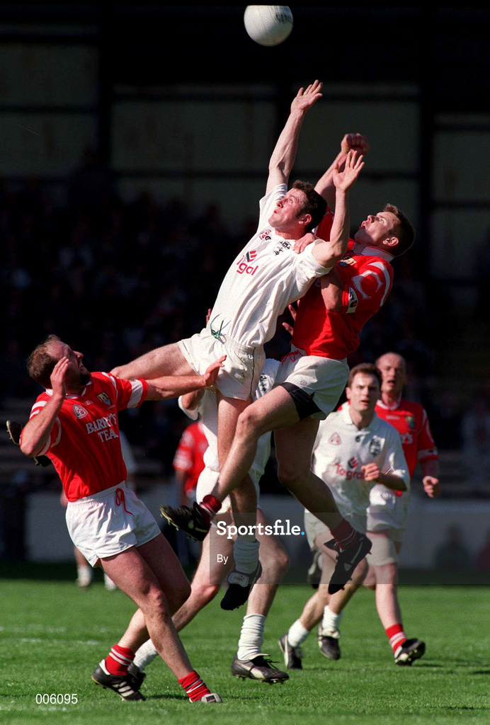 20 April 1997.Niall Buckley, Kildare, in action against Cork's Damien O'Neill and Brian Corcoran. Church & General   National League semi final, Croke Park.  Picture Credit: David Maher/SPORTSFILE.