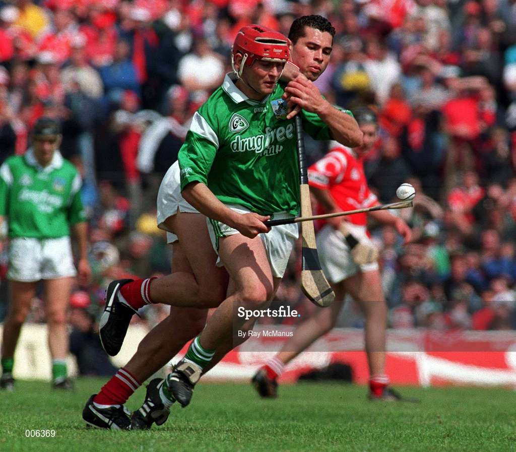 31 May 1998; TJ Tyan of Limerick is tackled by SeÃ¡n Og O hAilpin Cork during the Munster Senior Hurling Championship Quarter-Final match between Limerick and Cork at the Gaelic Grounds in Limerick. Photo by Ray McManus/Sportsfile