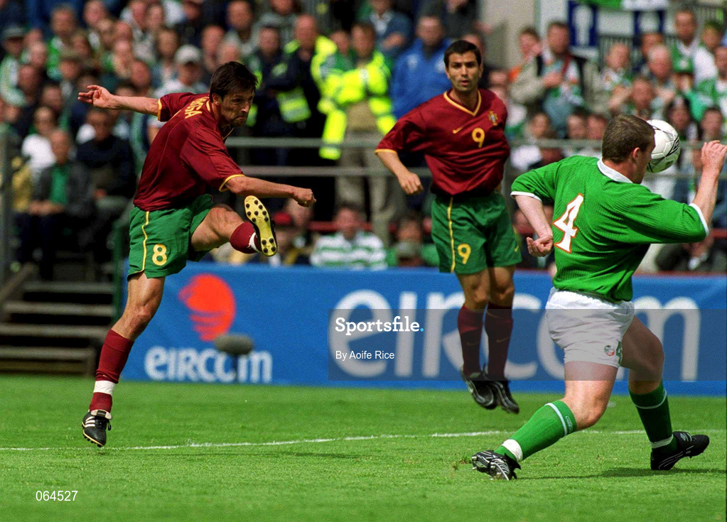 2 June 2001; Pedro Barbossa of Portugal has a shot on goal despite the efforts of Richard Dunne of Republic of Ireland during the FIFA World Cup 2002 Group 2 Qualifier match between Republic of Ireland and Portugal at Lansdowne Road in Dublin. Photo by Aoife Rice/Sportsfile