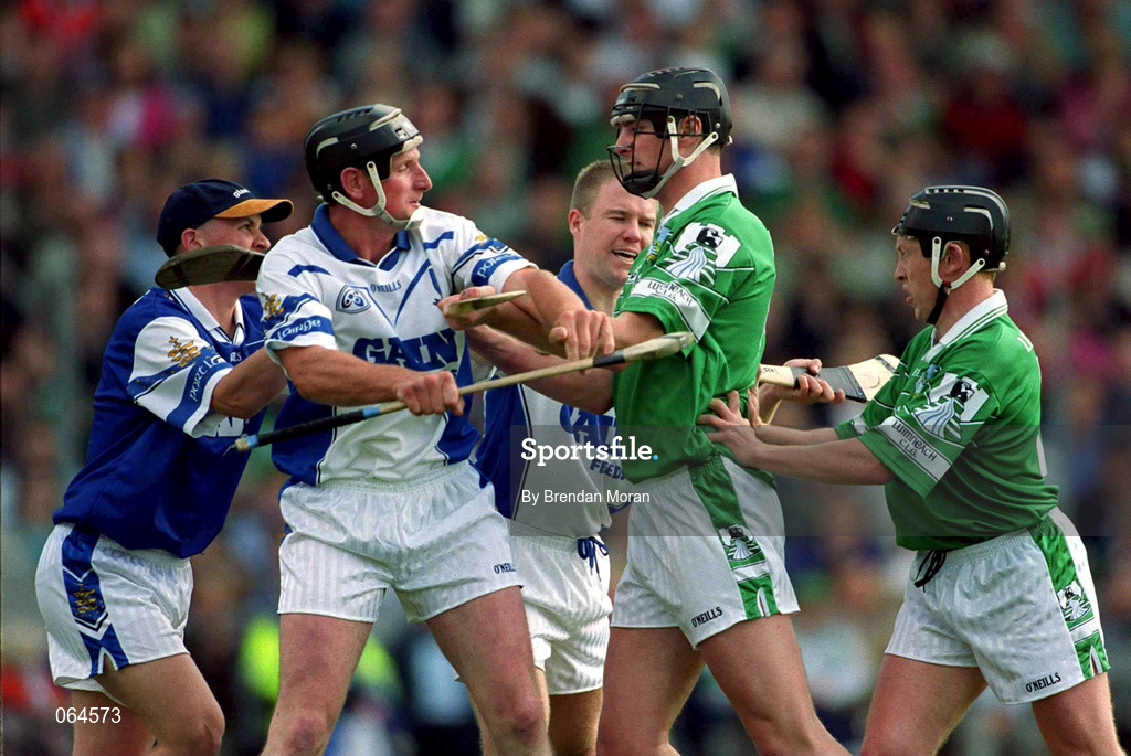 10 June 2001; Sean Cullinane of Waterford tussles with Brian Begley of Limerick during the Guinness Munster Senior Hurling Championship Semi-Final match between Limerick and Waterford at Páirc Uí Chaoimh in Cork. Photo by Brendan Moran/Sportsfile