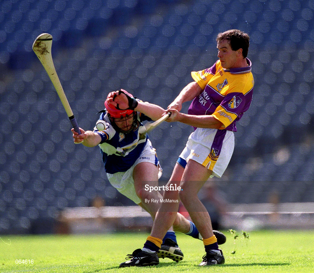 10 June 2001; Adrian Fenlon of Wexford in action against James Young of Laois during the Guinness Leinster Senior Hurling Championship Semi-Final match between Wexford and Laois at Croke Park in Dublin. Photo by Ray McManus/Sportsfile