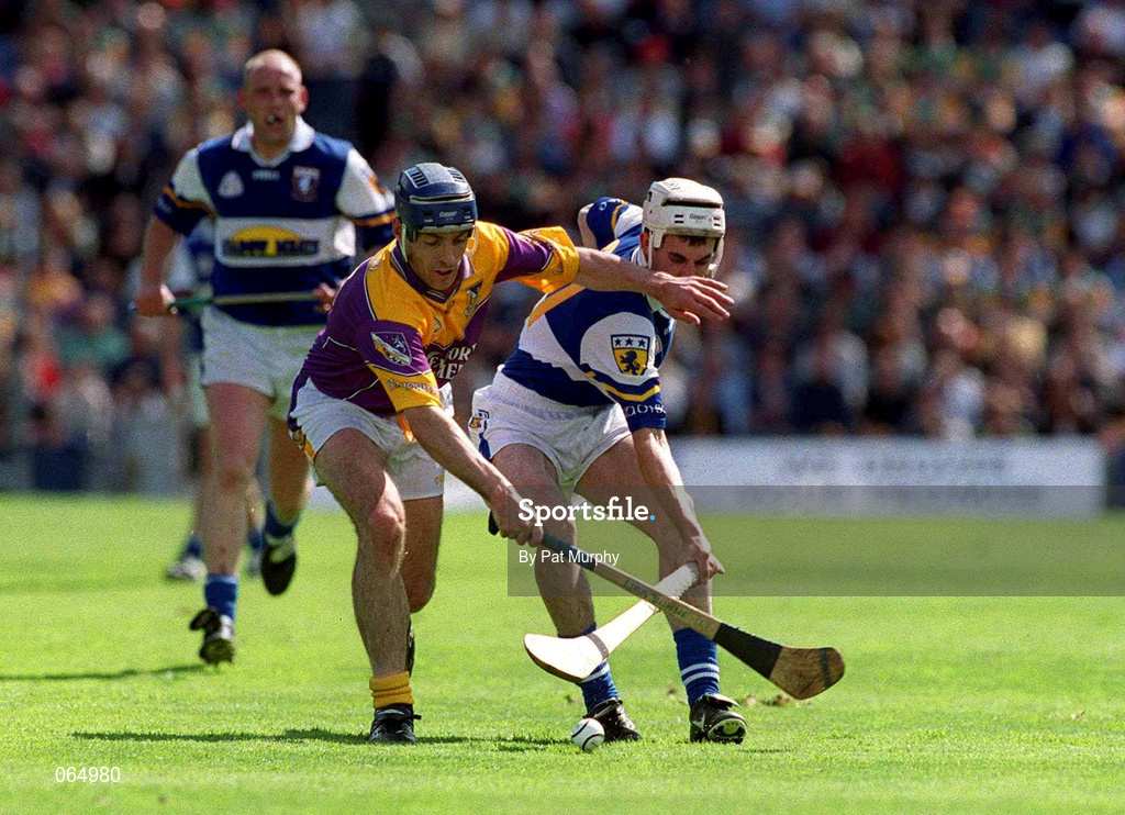 10 June 2001; Liam Dunne of Wexford in action against Patrick Phelan of Laois during the Guinness Leinster Senior Hurling Championship Semi-Final match between Wexford and Laois at Croke Park in Dublin. Photo by Pat Murphy/Sportsfile