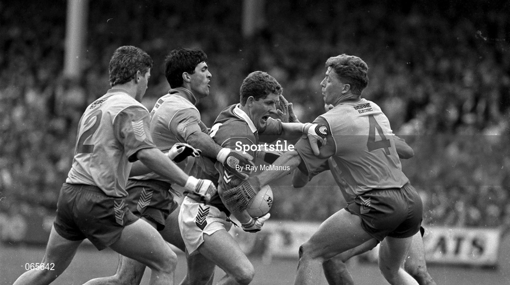 14 July 1991; Paul McStay of Mayo is tackled by Roscommon players, from left, Des Newton, Joey Connaughton and Gay Sheerin,4, and Enon Gavin, hidden, during the Connacht Senior Football Championship Final match between Mayo and Roscommon at McHale Park in Castlebar, Mayo. Photo by Ray McManus/Sportsfile
