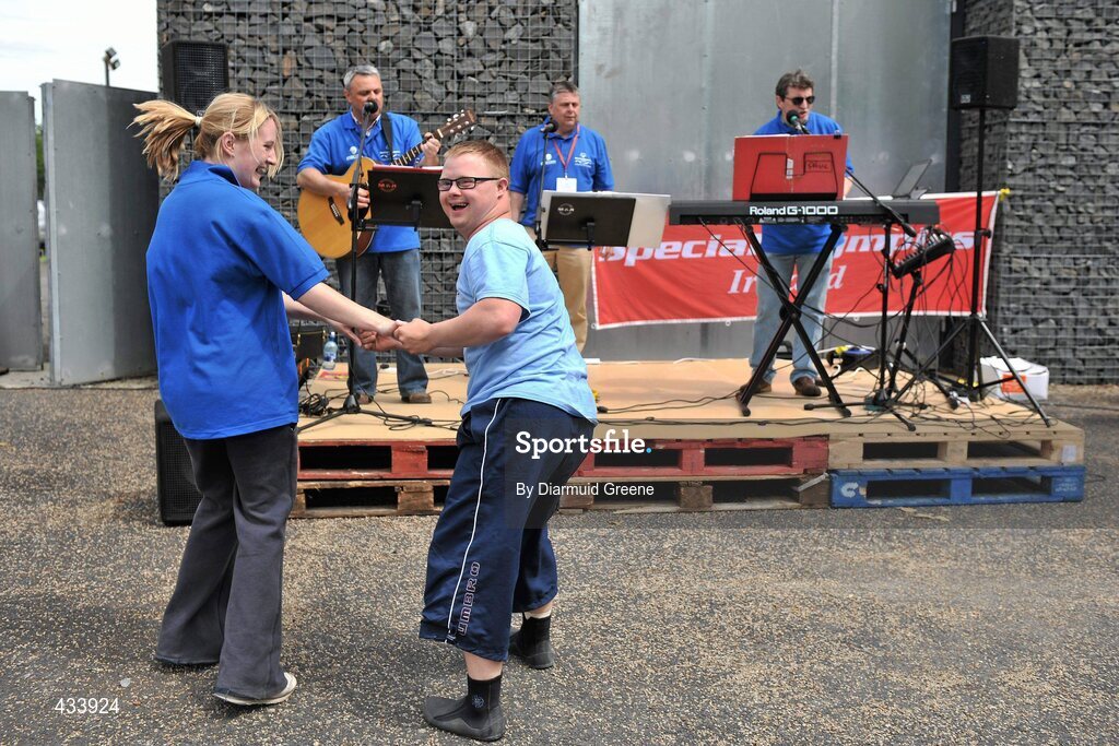 12 June 2010; Athlete Peadar Connolly, from Newry, Co. Down, dances with volunteer Sarah Pigott, while 'The Three Cords' entertain the crowd during the 2010 Special Olympics Ireland Games. University of Limerick Rowing Club, Limerick. Picture credit: Diarmuid Greene / SPORTSFILE