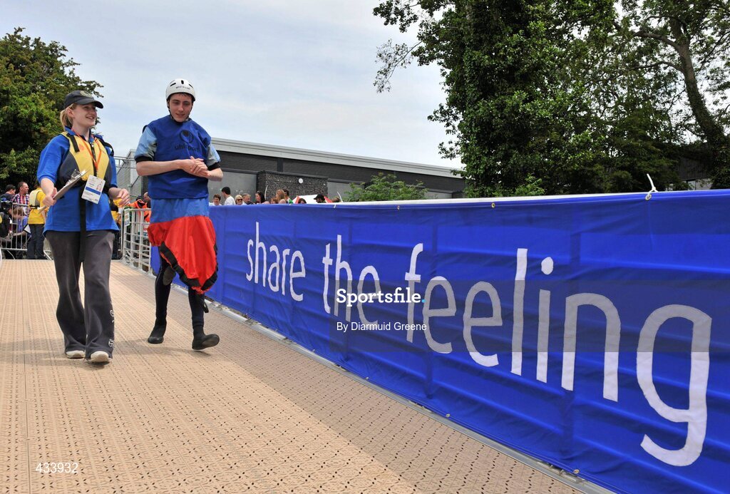 12 June 2010; Colin McVeigh, from Kilkeel, Co. Down, with co-ordinator Sarah Pigott, make their way down the ramp before the 200m, Round Final, Division 5, during the 2010 Special Olympics Ireland Games. University of Limerick Rowing Club, Limerick. Picture credit: Diarmuid Greene / SPORTSFILE