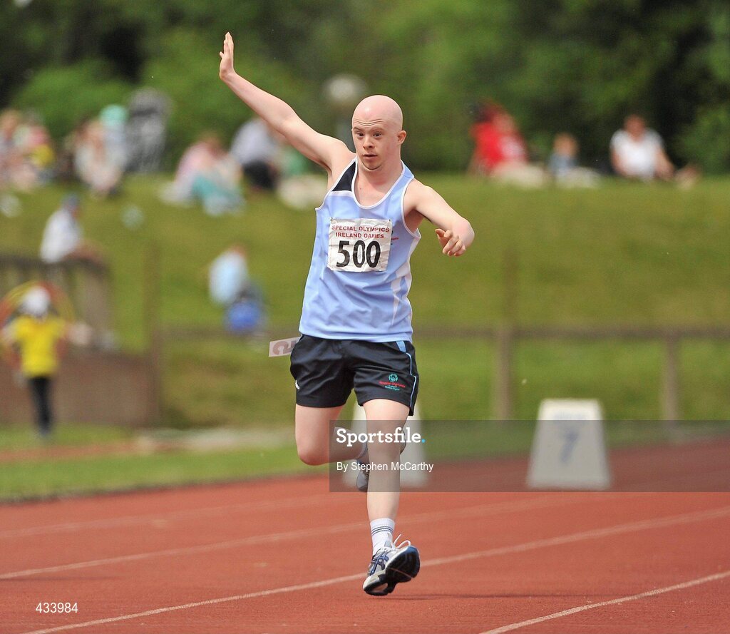 12 June 2010; Alan Larkin, from Ballymun, Dublin, salutes the crowd during his athletics event during the third day of the 2010 Special Olympics Ireland Games. University of Limerick, Limerick. Picture credit: Stephen McCarthy / SPORTSFILE