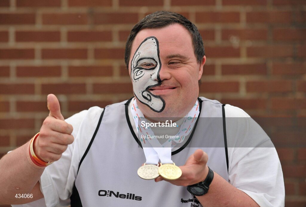 12 June 2010; Christopher McKinstry, from Belfast, Co. Antrim, sporting a maori face painting, celebrates with his gold and silver athletics medals during the 2010 Special Olympics Ireland Games. University of Limerick, Limerick. Picture credit: Diarmuid Greene / SPORTSFILE