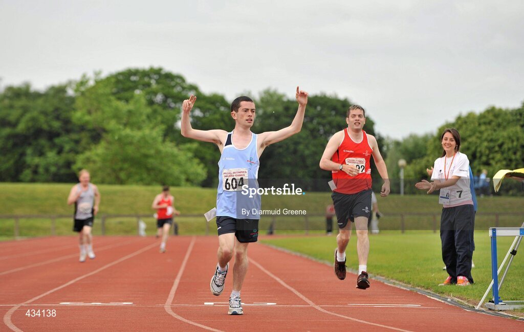 12 June 2010; Gary O'Brien, from Portmarnock, Dublin, celebrates as he crosses the finish line to win the 400m, division 129, as Jerry Crowley, from Mallow, Co. Cork, comes home to take second place, at the 2010 Special Olympics Ireland Games. University of Limerick, Limerick. Picture credit: Diarmuid Greene / SPORTSFILE