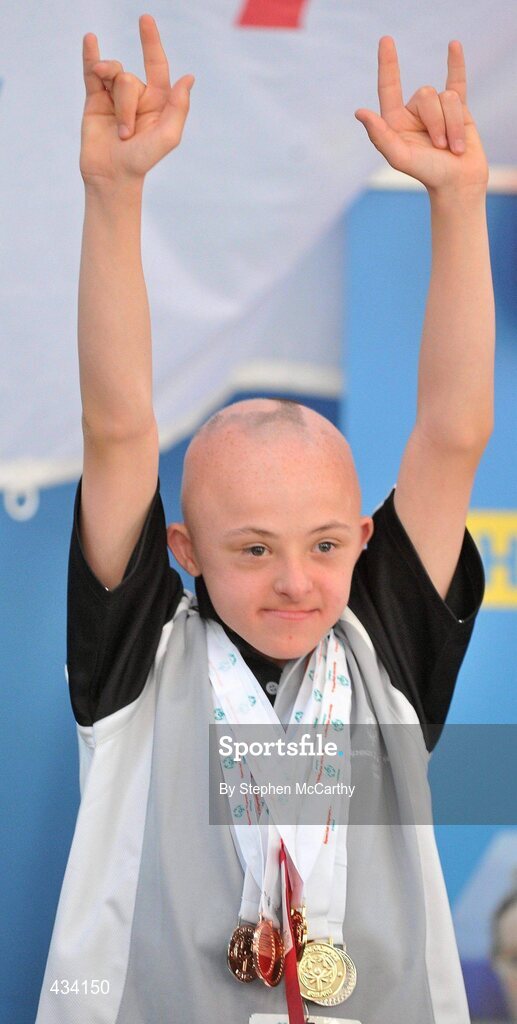 12 June 2010; Sean Irvine, Belfast, Antrim, Ulster Region, celebrates after receiving his medal during the Gymnastics medal presentation during the third day of the 2010 Special Olympics Ireland Games. University of Limerick, Limerick. Picture credit: Stephen McCarthy / SPORTSFILE
