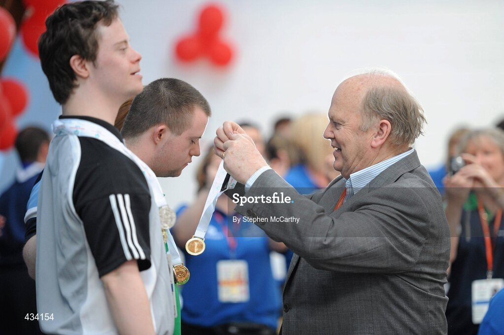 12 June 2010; Michael Noonan T.D., presents a medal during the Gymnastics medal presentation during the third day of the 2010 Special Olympics Ireland Games. University of Limerick, Limerick. Picture credit: Stephen McCarthy / SPORTSFILE