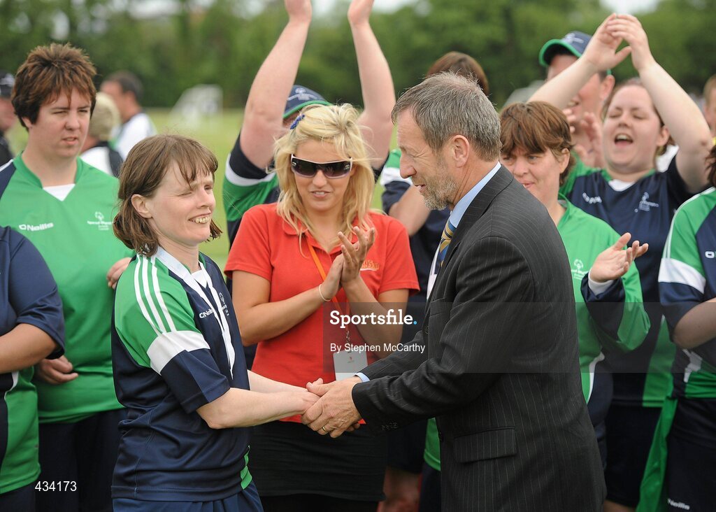 12 June 2010; Former GAA President Sean Kelly, MEP, presents Linda Cannon, from Athenry, Galway, Connacht Region, with her gold medal for women's 5-a-side football during the third day of the 2010 Special Olympics Ireland Games. University of Limerick, Limerick. Picture credit: Stephen McCarthy / SPORTSFILE