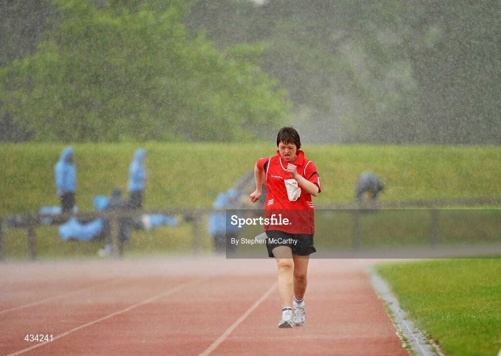 13 June 2010; Elizabeth Walsh, from Knocknagree, Kerry, competes amid a downpour during the 1500m walk & run athletics event during the final day of the 2010 Special Olympics Ireland Games. University of Limerick, Limerick. Picture credit: Stephen McCarthy / SPORTSFILE