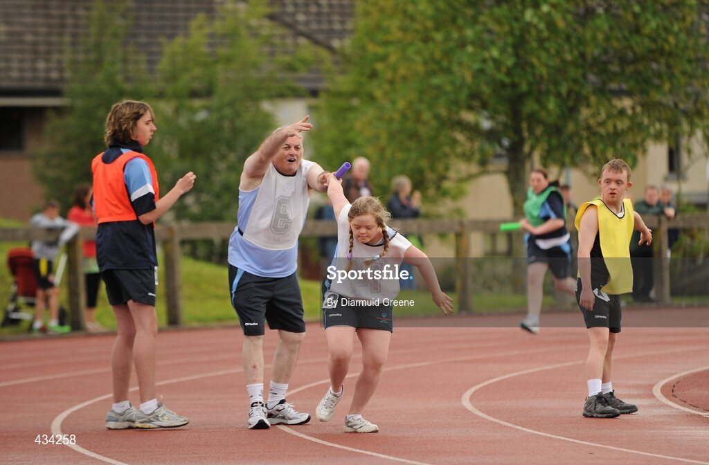 13 June 2010; Sarah-Kate Breen, from Blackrock, Dublin, receives the baton and words of encouragement from team-mate Paul Kilbride, from Kilcoole, Co. Wicklow, during the 4x100m Relay Final, division 21, at the 2010 Special Olympics Ireland Games. University of Limerick, Limerick. Picture credit: Diarmuid Greene / SPORTSFILE
