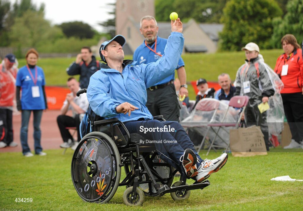 13 June 2010; Thomas O'Neill, from Crumlin, Dublin, in action during the tennis ball throw, watched by volunteer Pat Olwill, from Co. Carlow, during the 2010 Special Olympics Ireland Games. University of Limerick, Limerick. Picture credit: Diarmuid Greene / SPORTSFILE
