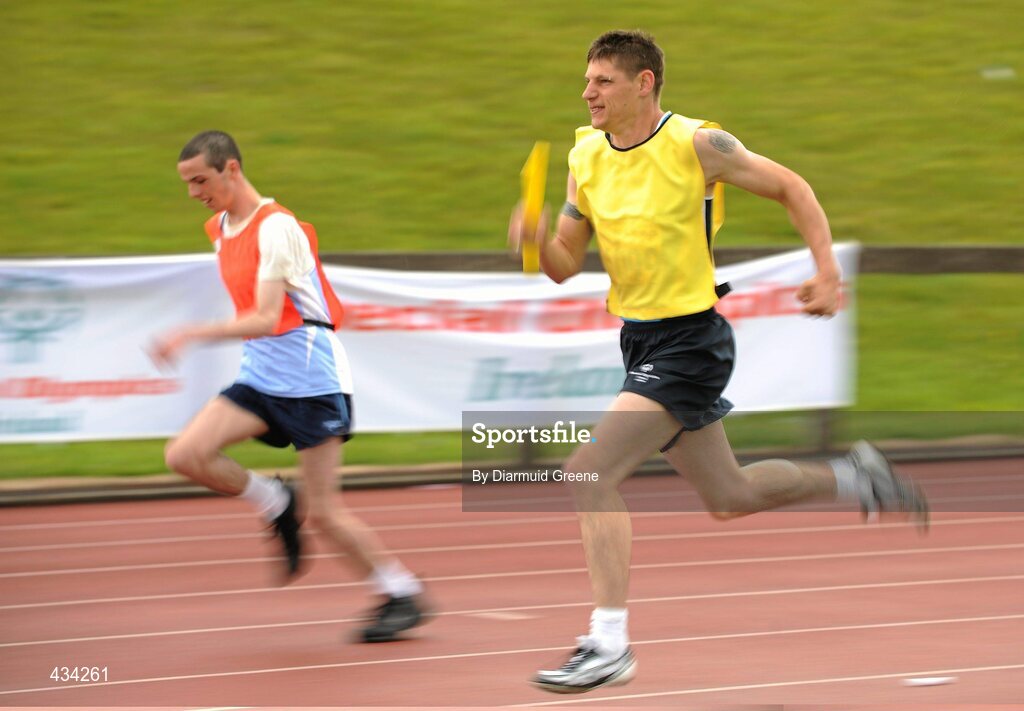 13 June 2010; Keith Skelly, from Drogheda, Co. Louth, Leinster, right, on his way helping his team win the 4x100m Relay Final, division 26, from second place team Eastern Region, Dermot Ryan, from Navan Road, Dublin, left, during the 2010 Special Olympics Ireland Games. University of Limerick, Limerick. Picture credit: Diarmuid Greene / SPORTSFILE