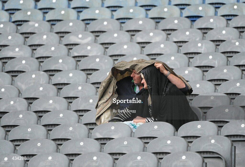 13 June 2010; Spectators shelter from the rain. Leinster GAA Football Senior Championship Quarter-Final, Meath v Laois, Croke Park, Dublin. Picture credit: Barry Cregg / SPORTSFILE