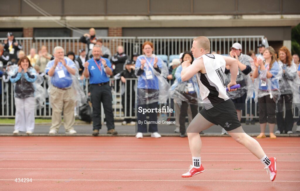 13 June 2010; James Neeson, from Maghera, Co. Derry, the very last competitior to finish an athletics event, the 4x400 Relay Final, division 20, is cheered on by supporters on his approach to the finish line at the 2010 Special Olympics Ireland Games. University of Limerick, Limerick. Picture credit: Diarmuid Greene / SPORTSFILE