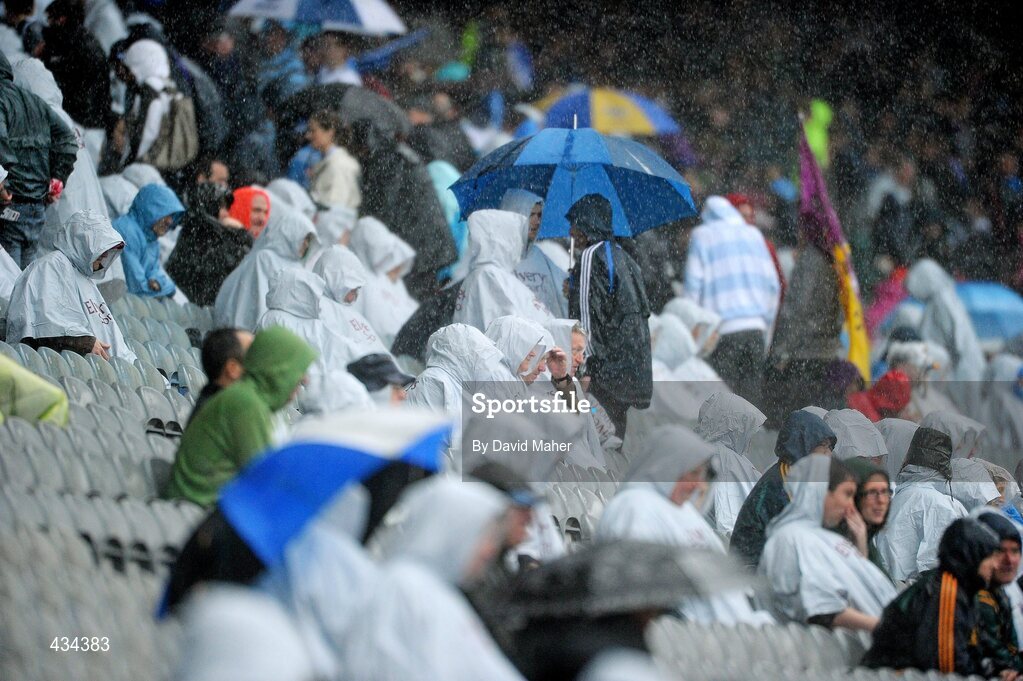 13 June 2010; Spectators take shelter during the heavy rain. Leinster GAA Football Senior Championship Quarter-Final, Meath v Laois, Croke Park, Dublin. Picture credit: David Maher / SPORTSFILE