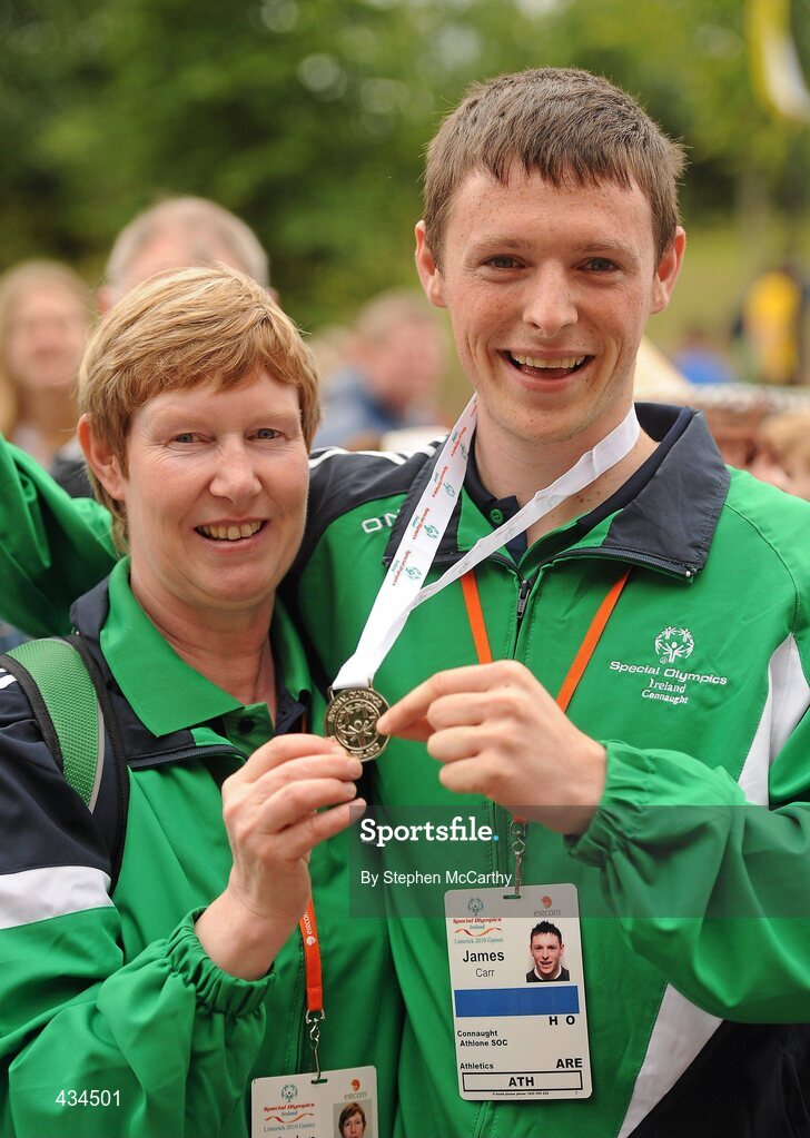 13 June 2010; Connacht Region athlete James Carr, from Athlone, Westmeath, and his chapperone Marion Lynch celebrate his silver medal in the relay atheltics event during the final day of the 2010 Special Olympics Ireland Games. University of Limerick, Limerick. Picture credit: Stephen McCarthy / SPORTSFILE