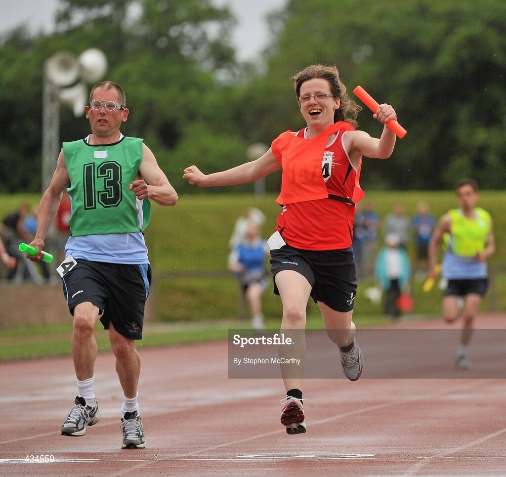13 June 2010; Rachel Ryan, Tipperary, red bib, and John Naughton, Irishtown, Dublin, complete the final leg of the 4x100m relay for his Munster and Eastern Region teams during the final day of the 2010 Special Olympics Ireland Games. University of Limerick, Limerick. Picture credit: Stephen McCarthy / SPORTSFILE