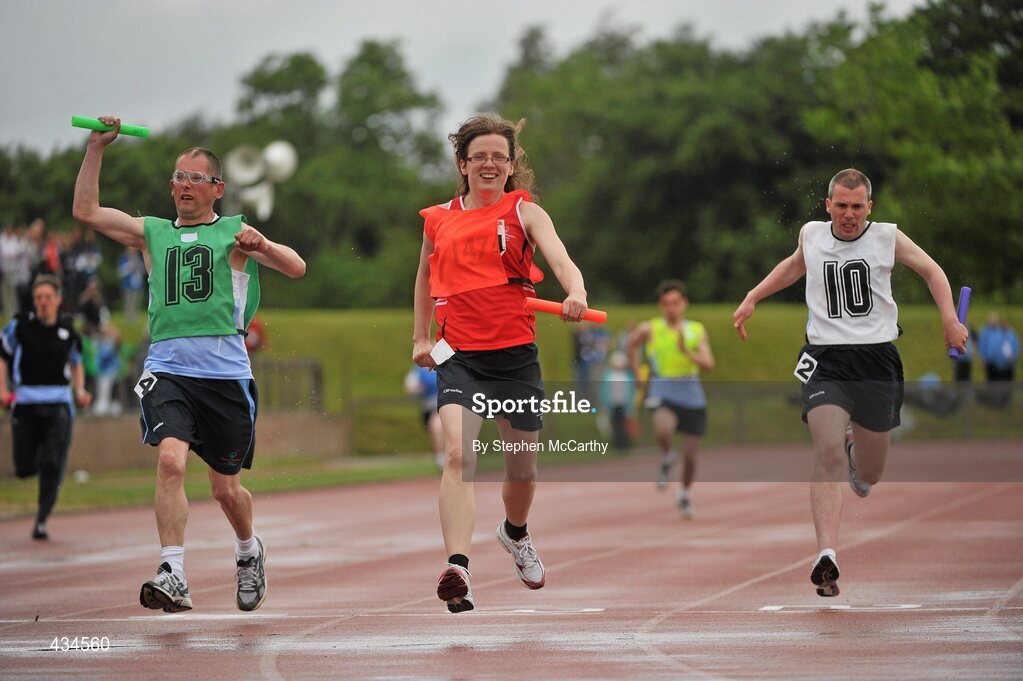 13 June 2010; Rachel Ryan, Tipperary, red bib, and John Naughton, Irishtown, Dublin, complete the final leg of the 4x100m relay for his Munster and Eastern Region teams during the final day of the 2010 Special Olympics Ireland Games. University of Limerick, Limerick. Picture credit: Stephen McCarthy / SPORTSFILE