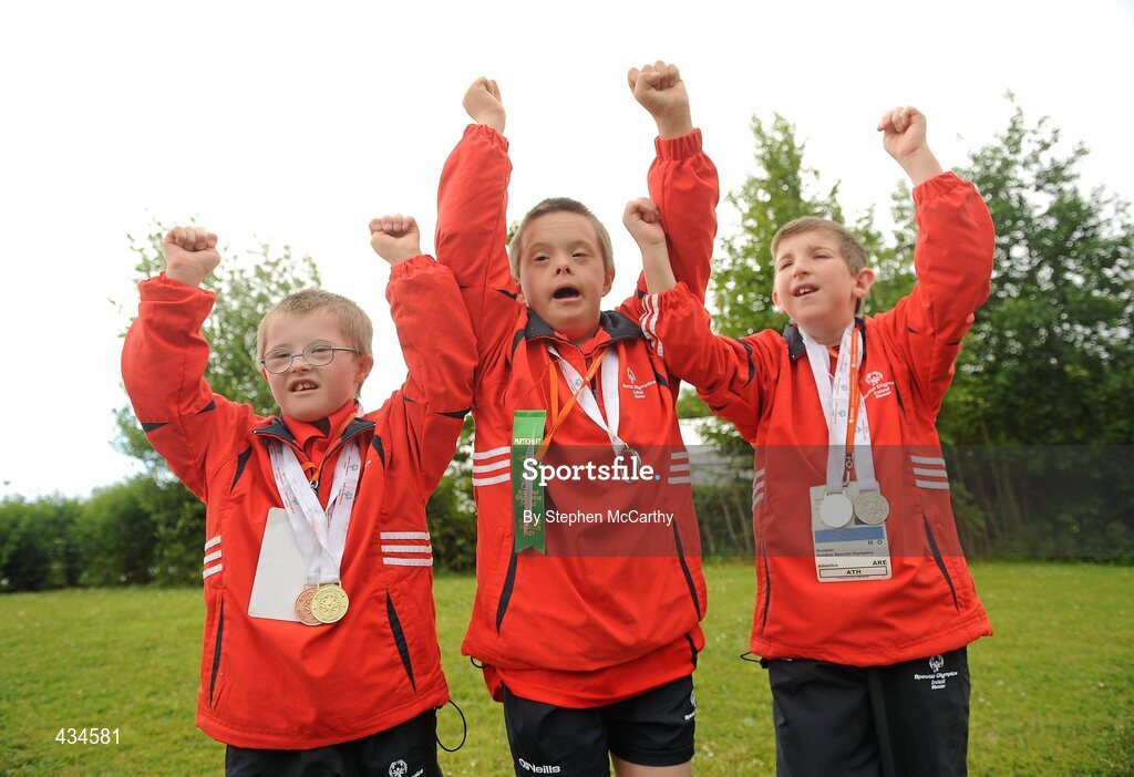 13 June 2010; Bandon, Cork, athletes, from left, Conor O'Dwyer, Ronan Desmond and Liam Buckley celebrate with friends and family after collecting their medals during the final day of the 2010 Special Olympics Ireland Games. University of Limerick, Limerick. Picture credit: Stephen McCarthy / SPORTSFILE