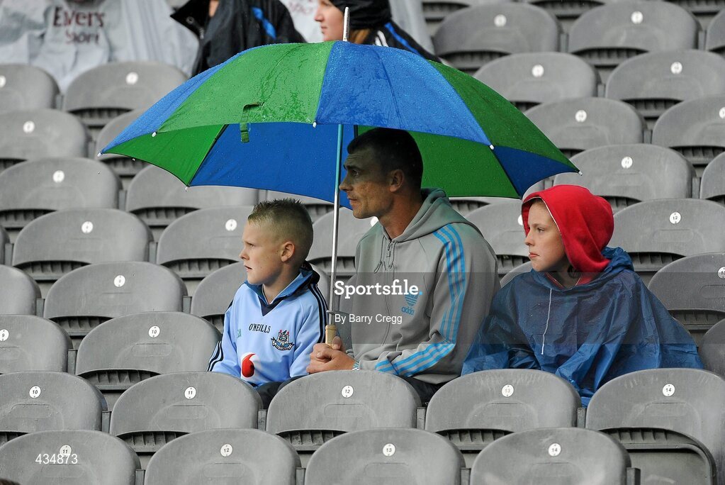 13 June 2010; Dublin fans take cover from the rain. Leinster GAA Football Senior Championship Quarter-Final, Dublin v Wexford, Croke Park, Dublin. Picture credit: Barry Cregg / SPORTSFILE