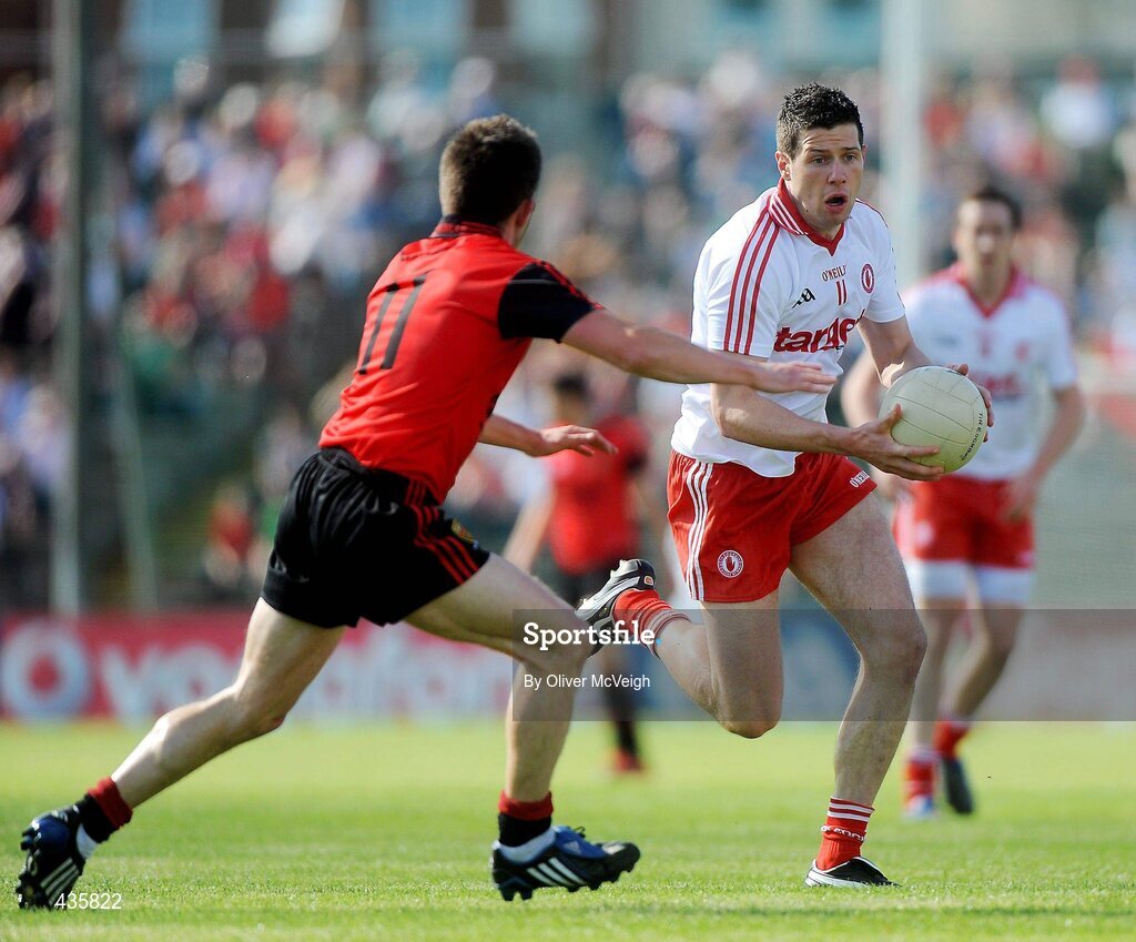 19 June 2010; Sean Cavanagh, Tyrone, in action against Mark Poland, Down. Ulster GAA Football Senior Championship Semi-Final, Tyrone v Down, Casement Park, Belfast, Co. Antrim. Picture credit: Oliver McVeigh / SPORTSFILE