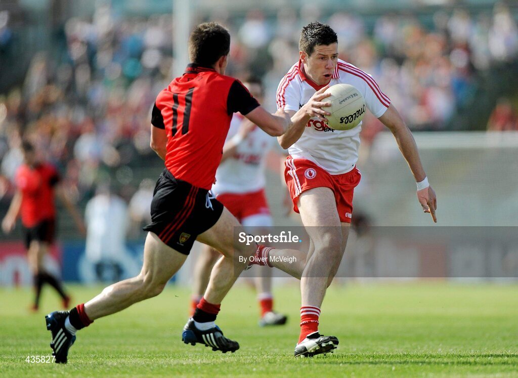 19 June 2010; Sean Cavanagh, Tyrone, in action against Mark Poland, Down. Ulster GAA Football Senior Championship Semi-Final, Casement Park, Belfast, Co. Antrim. Picture credit: Oliver McVeigh / SPORTSFILE