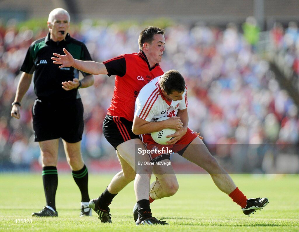 19 June 2010; Brian McGuigan, Tyrone, in action against Conor Garvey, Down. Ulster GAA Football Senior Championship Semi-Final, Casement Park, Belfast, Co. Antrim. Picture credit: Oliver McVeigh / SPORTSFILE