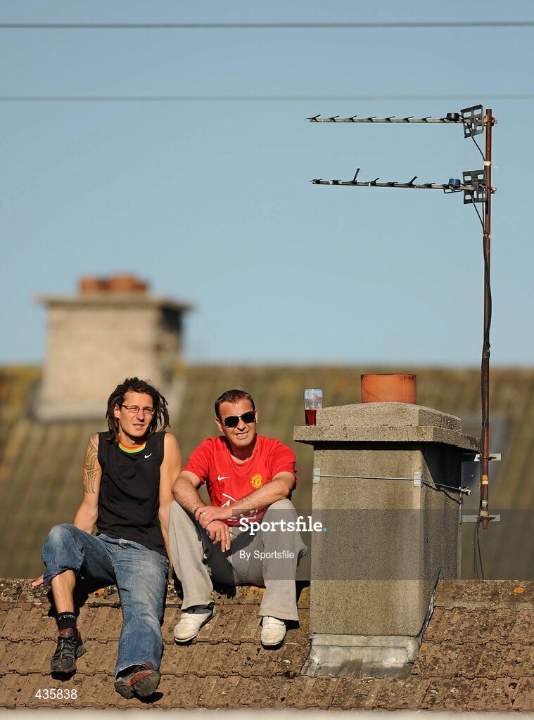 19 June 2010; Two supporters watch the game from a rooftop vantage point. Leinster GAA Football Senior Championship Quarter-Final Replay, Meath v Laois, O'Connor Park, Tullamore, Co. Offaly. Photo by Sportsfile