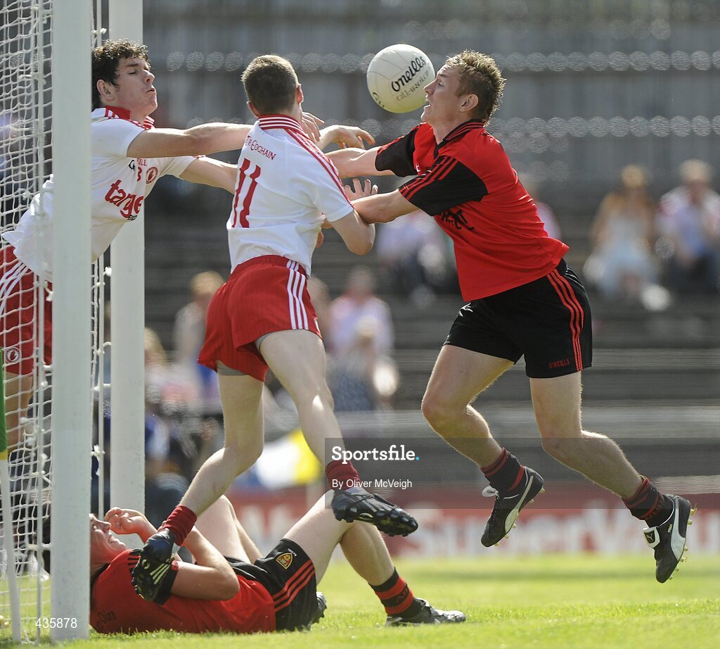 19 June 2010; Harry Og Conlon and Thomas Canavan, Tyrone, save the ball off the line despite the efforts of Caolan Mooney, Down. Tyrone v Down - Ulster GAA Football Minor Championship Quarter-Finall, Tyrone v Down, Casement Park, Belfast, Co. Antrim. Picture credit: Oliver McVeigh / SPORTSFILE