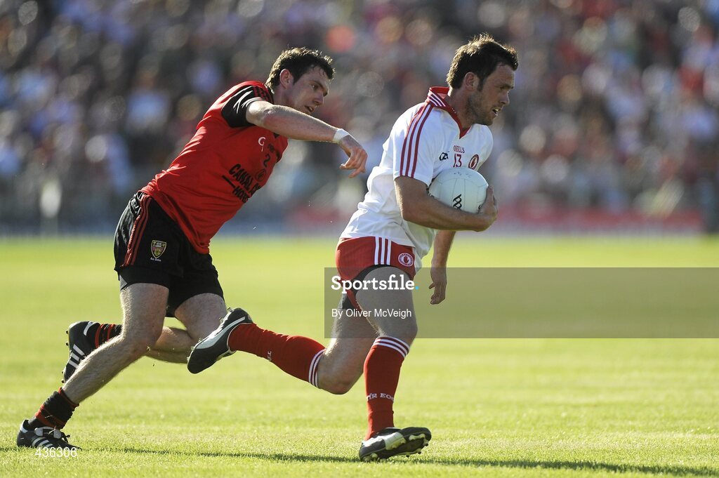 19 June 2010; Martin Penrose, Tyrone, in action against Declan Rooney, Down. Ulster GAA Football Senior Championship Semi-Final, Tyrone v Down, Casement Park, Belfast, Co. Antrim. Picture credit: Oliver McVeigh / SPORTSFILE