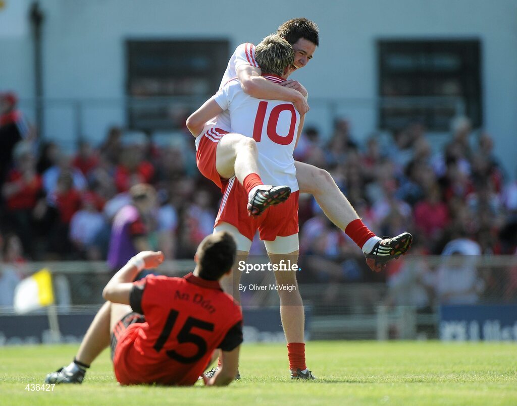 19 June 2010; Conor Clarke and Richard Donnelly, Tyrone, celebrate at the end of the game as Rya O'Hare, Down, looks on. Ulster GAA Football Minor Championship Semi-Final, Tyrone v Down, Casement Park, Belfast, Co. Antrim. Picture credit: Oliver McVeigh / SPORTSFILE