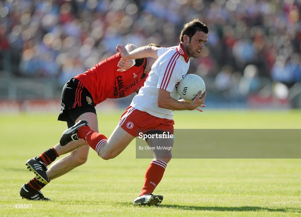 19 June 2010; Martin Penrose, Tyrone, in action against Declan Rooney, Down. Ulster GAA Football Senior Championship Semi-Final, Casement Park, Belfast, Co. Antrim. Picture credit: Oliver McVeigh / SPORTSFILE