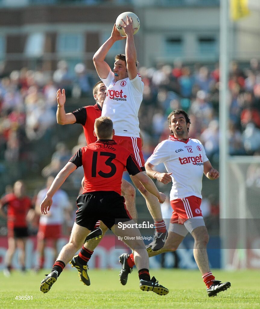 19 June 2010; Dermot Carlin, Tyrone, in action against Dan Gordon, Down. Ulster GAA Football Senior Championship Semi-Final, Casement Park, Belfast, Co. Antrim. Picture credit: Oliver McVeigh / SPORTSFILE