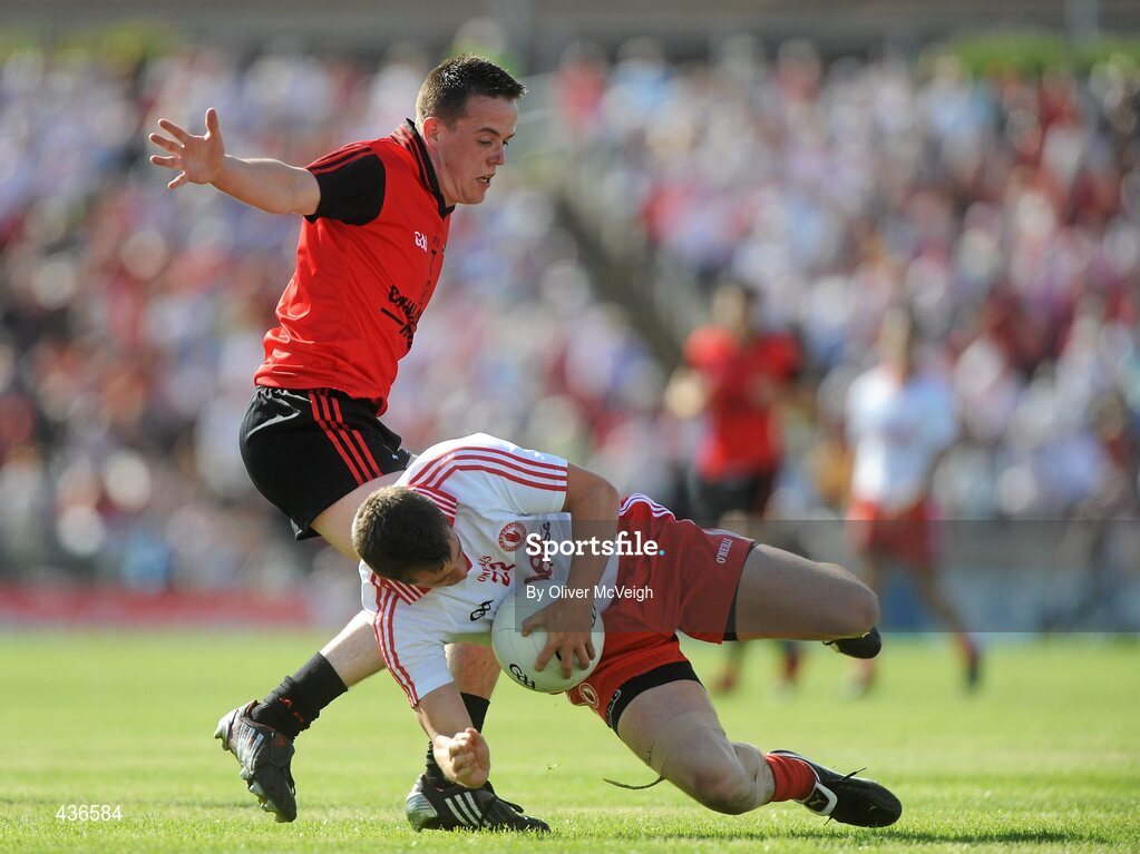 19 June 2010; Brian McGuigan, Tyrone, in action against Conor Garvey, Down. Ulster GAA Football Senior Championship Semi-Final, Casement Park, Belfast, Co. Antrim. Picture credit: Oliver McVeigh / SPORTSFILE
