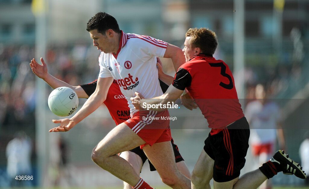 19 June 2010; Sean Cavanagh, Tyrone, in action against Conor Maginn and Brendan McArdle, Down. Ulster GAA Football Senior Championship Semi-Final, Casement Park, Belfast, Co. Antrim. Picture credit: Oliver McVeigh / SPORTSFILE