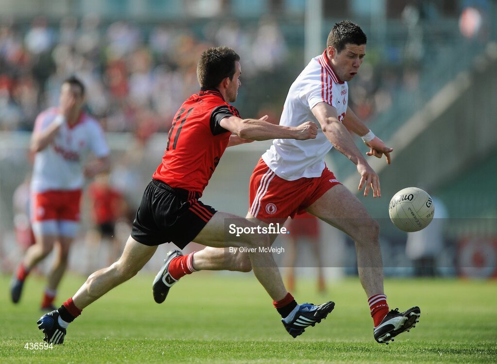 19 June 2010; Sean Cavanagh, Tyrone, in action against Mark Poland, Down. Ulster GAA Football Senior Championship Semi-Final, Casement Park, Belfast, Co. Antrim. Picture credit: Oliver McVeigh / SPORTSFILE