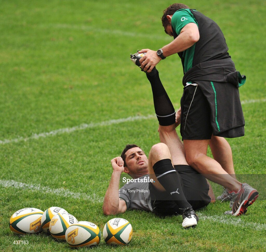 25 June 2010; Ireland's Rob Kearney has his leg stretched by team physio Cameron Steele during the Captain's Run ahead of their game against Australia on Saturday. Suncorp Stadium, Brisbane, Australia. Picture credit: Tony Phillips / SPORTSFILE