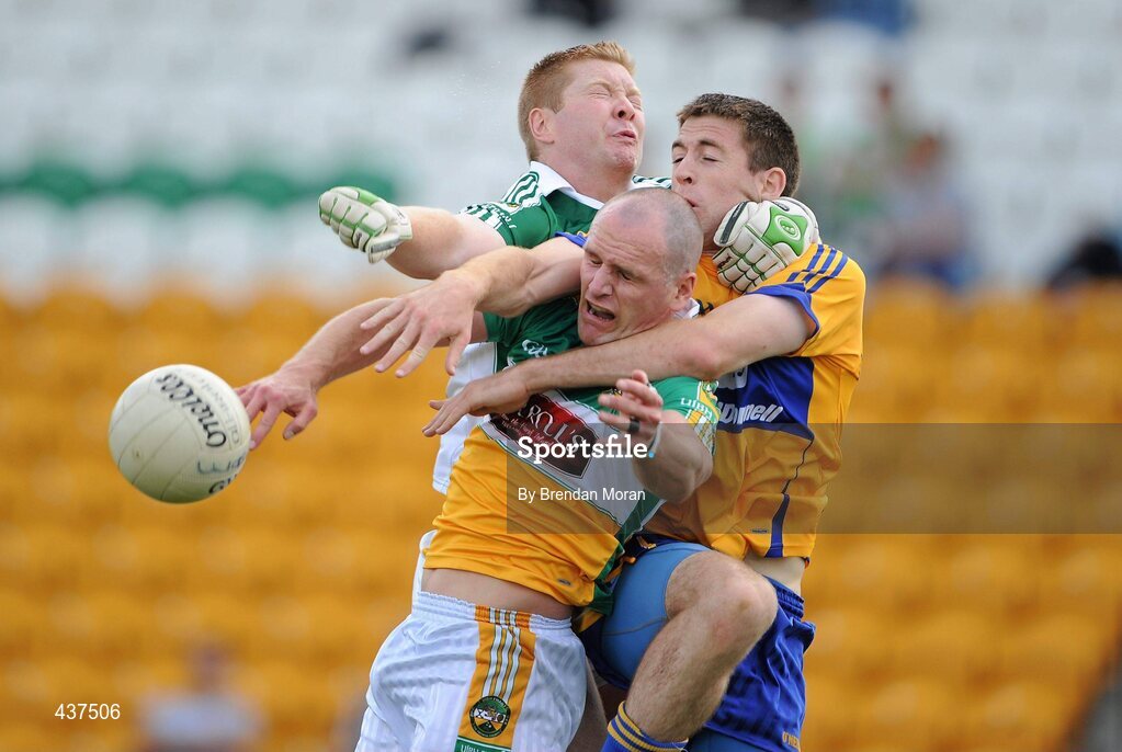 26 June 2010; Offaly goalkeeper Alan Mulhall, left, and full-back Scott Brady contest a high ball with Gary Brennan, Clare. GAA Football All-Ireland Senior Championship Qualifier Round 1, Offaly v Clare, O'Connor Park, Tullamore, Co. Offaly. Picture credit: Brendan Moran / SPORTSFILE