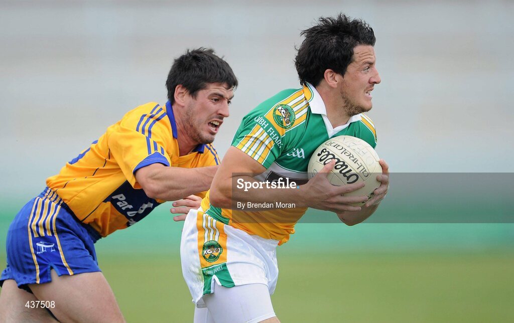26 June 2010; John Reynolds, Offaly, in action against Diarmuid Daly, Clare. GAA Football All-Ireland Senior Championship Qualifier Round 1, Offaly v Clare, O'Connor Park, Tullamore, Co. Offaly. Picture credit: Brendan Moran / SPORTSFILE