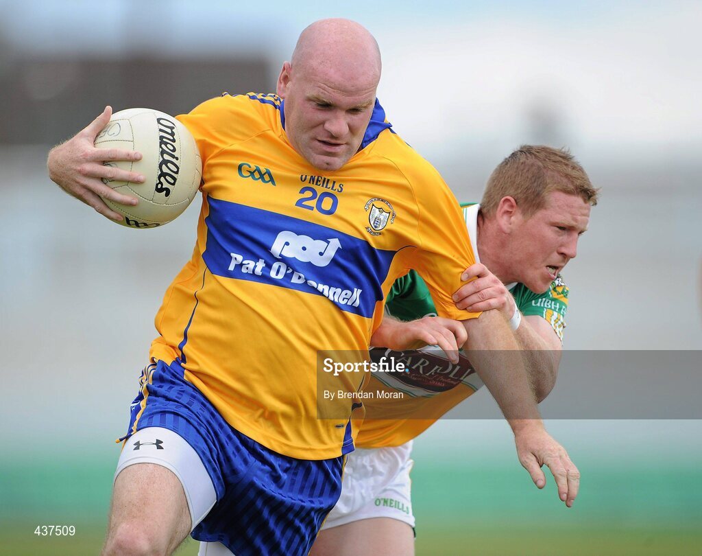 26 June 2010; Des Molohan, Clare, holds off the challenge of Brian Darby, Offaly. GAA Football All-Ireland Senior Championship Qualifier Round 1, Offaly v Clare, O'Connor Park, Tullamore, Co. Offaly. Picture credit: Brendan Moran / SPORTSFILE