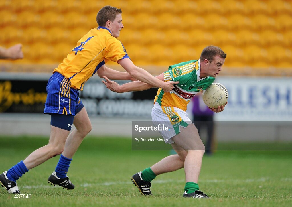 26 June 2010; David Egan, Offaly, holds off the challenge of Brian Carrig, Clare, on the way to scoring his side's first goal. GAA Football All-Ireland Senior Championship Qualifier Round 1, Offaly v Clare, O'Connor Park, Tullamore, Co. Offaly. Picture credit: Brendan Moran / SPORTSFILE